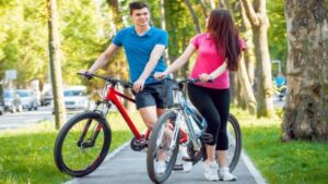 couple riding hardtail mountain bike