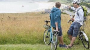 two guys riding long distance on hybrid bikes
