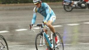 Man riding his road bike in the rain
