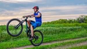 a-man-doing-the-wheelie-trick-with-a-mountain-bike