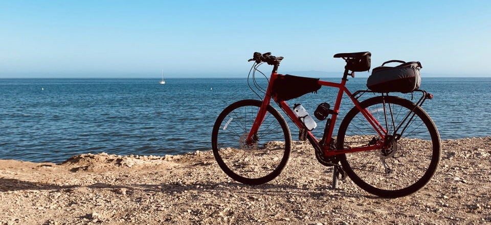 a red bike near the beach
