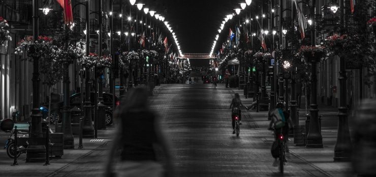 people riding their bikes in the city